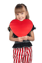 Image showing Little girl with red heart