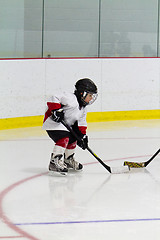 Image showing Little boy playing ice hockey