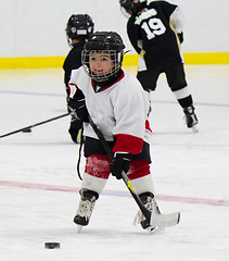 Image showing Little boy playing ice hockey