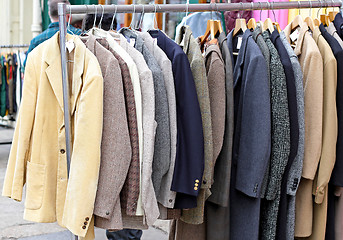 Image showing Suits at rail