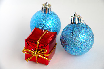 Image showing Two christmas bulbs and gift