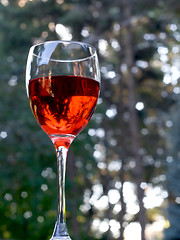 Image showing Glass of red wine outdoors