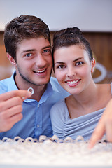 Image showing happy young couple in jewelry store