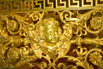 Image showing Openwork grille with gilded angel.