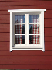 Image showing white window on red house