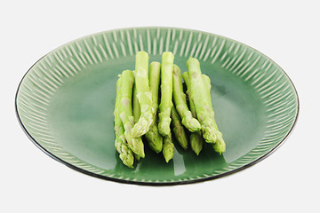 Image showing Fresh asparagus shoots on a plate