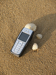 Image showing Mobile phone on the beach