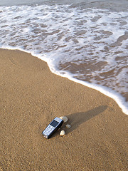 Image showing Mobile phone and the sea