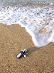 Image showing Mobile phone and the sea
