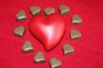 Image showing Red heart surrounded of chocolate hearts