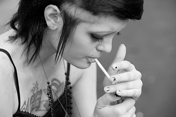 Image showing punk girl smokes a cigarette