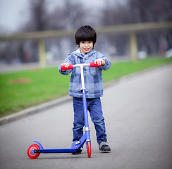 Image showing boy with scooter