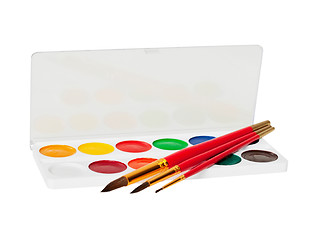Image showing Watercolor paints and brushes on white
