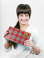 Image showing beautiful blue eyed young happy smiling girl with a gift box