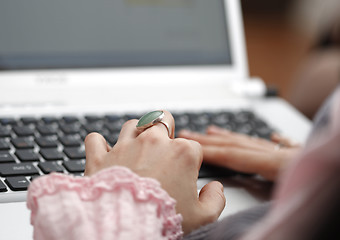 Image showing Young woman working on laptop