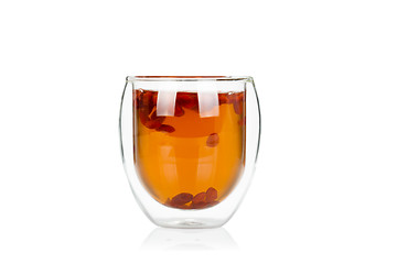 Image showing Cup of delicious hot goji berry potion on white