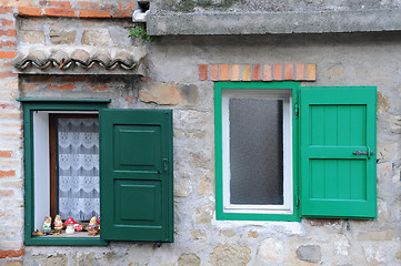 Image showing Two Windows with Green Shutters