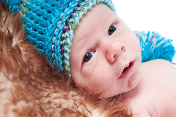 Image showing Newborn baby in knitted blue hat