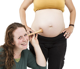 Image showing midwife listening at human belly