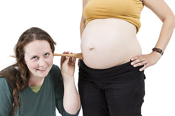 Image showing midwife listening at human belly