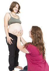 Image showing midwife fingering at human belly