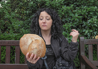 Image showing Girl eating bread