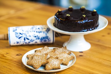 Image showing Rich chocolate cake and star shaped cookies