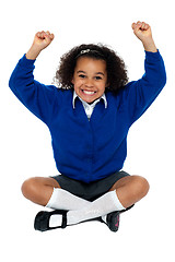 Image showing Primary school girl grinding her teeth in excitement