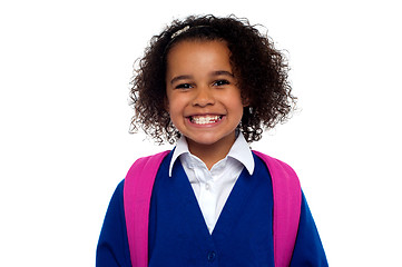 Image showing Beautiful girl in uniform with backpack smiling at you