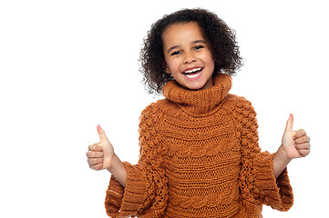 Image showing Pretty kid laughing and showing double thumbs up