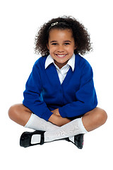 Image showing Charming African school girl flashing a smile