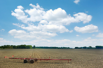 Image showing Red cart left in the field