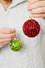 Image showing Red and green Christmas baubles