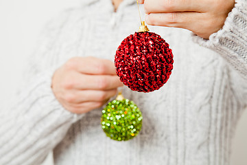 Image showing Red and green Christmas baubles