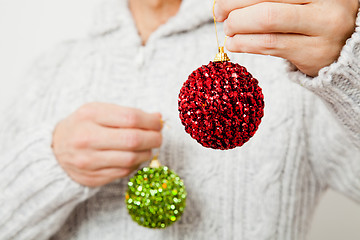 Image showing Red and green Christmas baubles