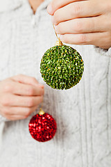 Image showing Red and green Christmas baubles