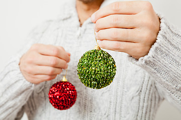 Image showing Red and green Christmas baubles