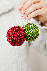 Image showing Red and green Christmas baubles