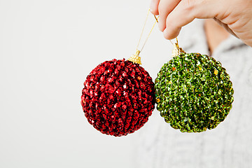 Image showing Red and green Christmas baubles