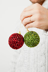 Image showing Green and red Christmas baubles