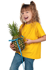 Image showing Little girl with pineapple