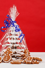 Image showing christmas gingerbreads tree on red background