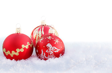 Image showing christmas balls on white snow 