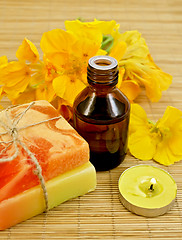 Image showing Oil with nasturtiums and candle