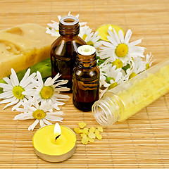 Image showing Oil yellow with soap and candles