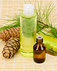 Image showing Oil and shower gel with cedar cones