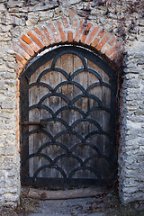 Image showing Old wooden door from medieval era.