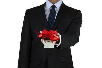 Image showing businessman holding cash with ribbon