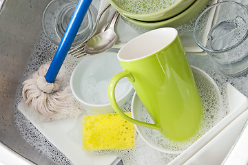 Image showing Washing bright dishes