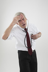 Image showing Sick man checking his own heart